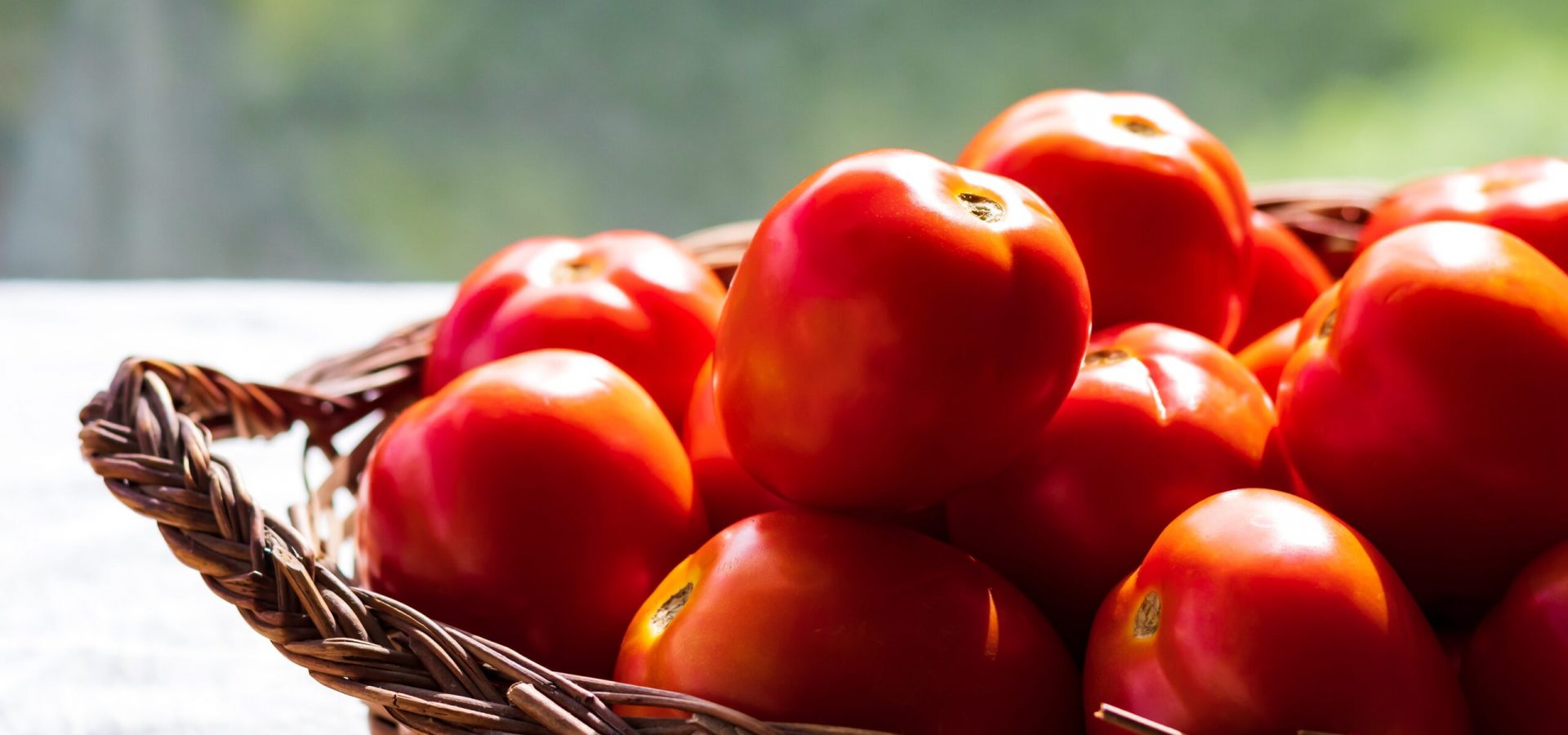 Fresh ripe tomatoes Basket of fresh tomatoes